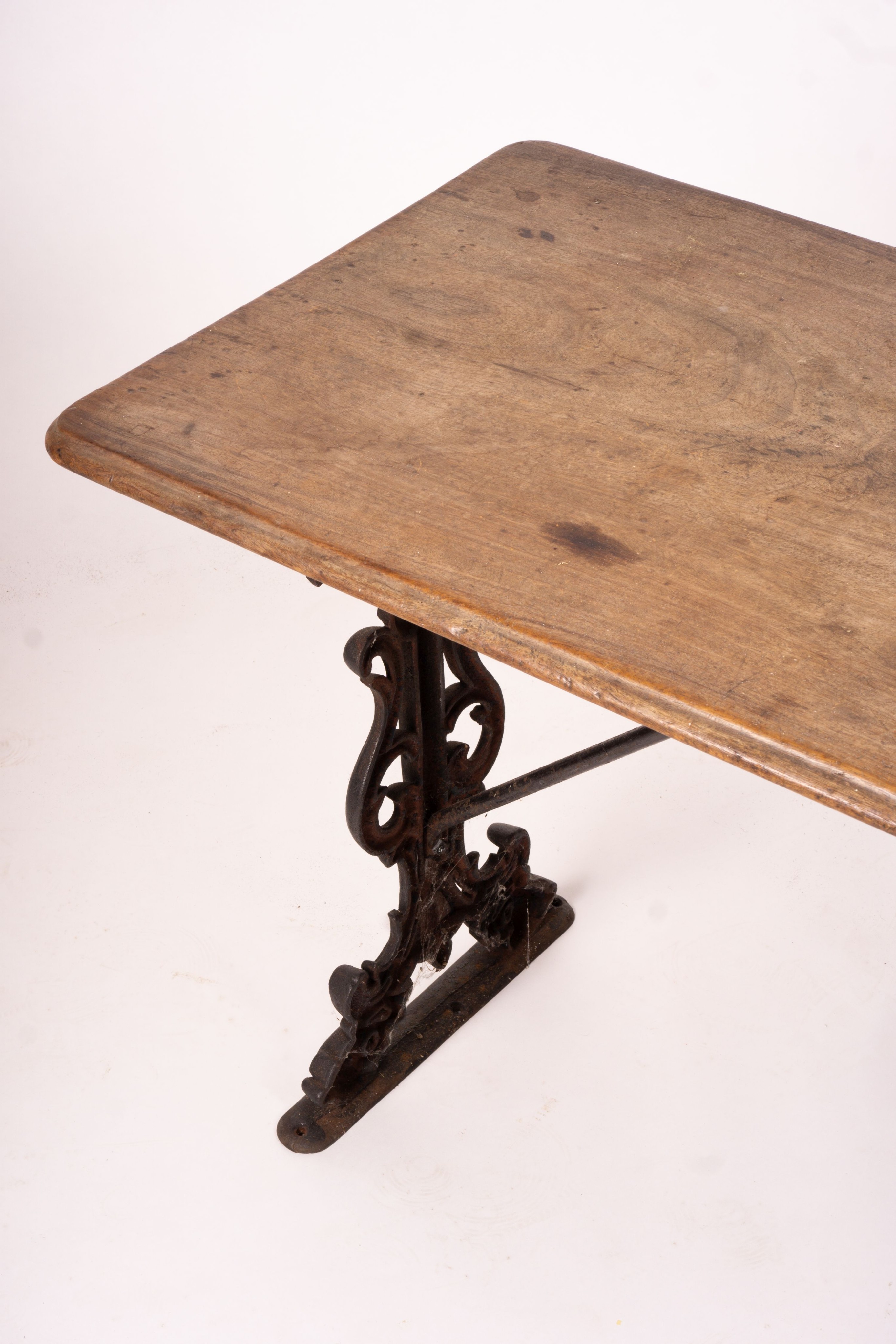 A Victorian style rectangular mahogany and cast iron tavern table, width 120cm, depth 52cm, height 69cm